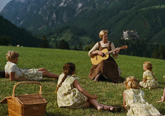 Maria and the children on the hill in front of fortress Hohenwerfen