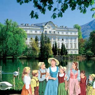 Maria and children singing in front of Leopoldskron in the movie The Sound of Music
